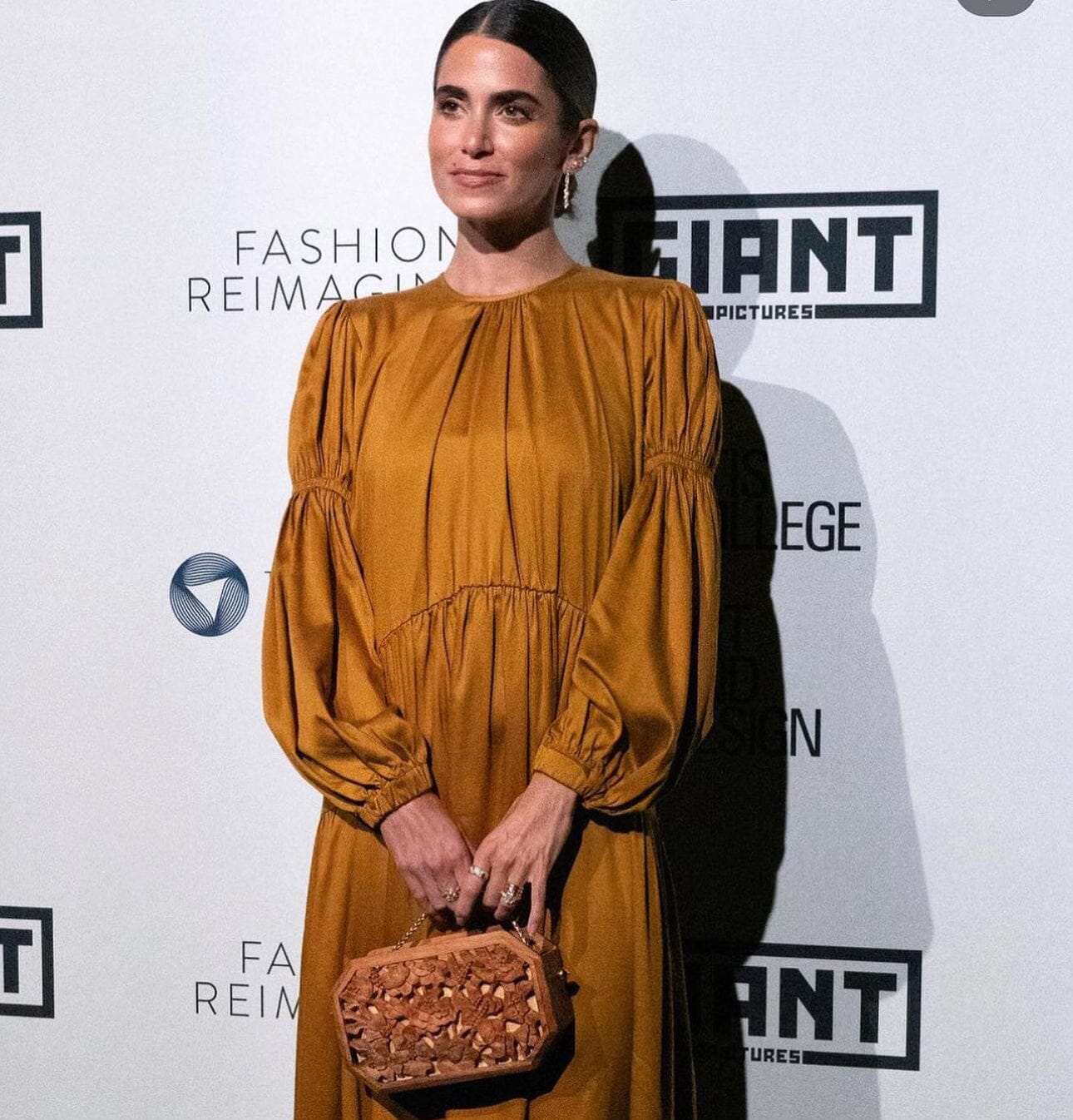 Nikki Reed carries Blumera x MycoWorks Collab Clutch to LA Fashion Week